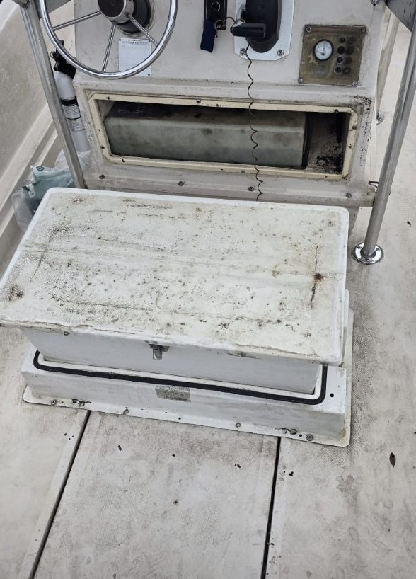 Before: helm and console area worn and dirty
