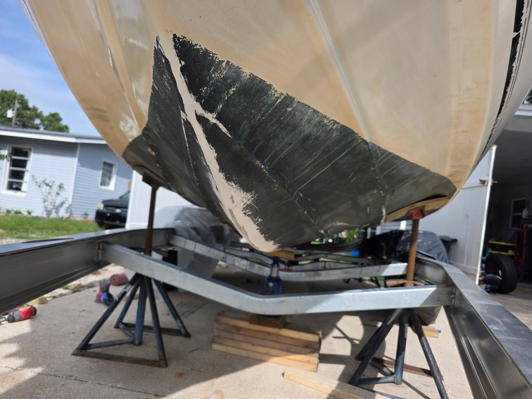 Boat hull on a trailer during repair prep