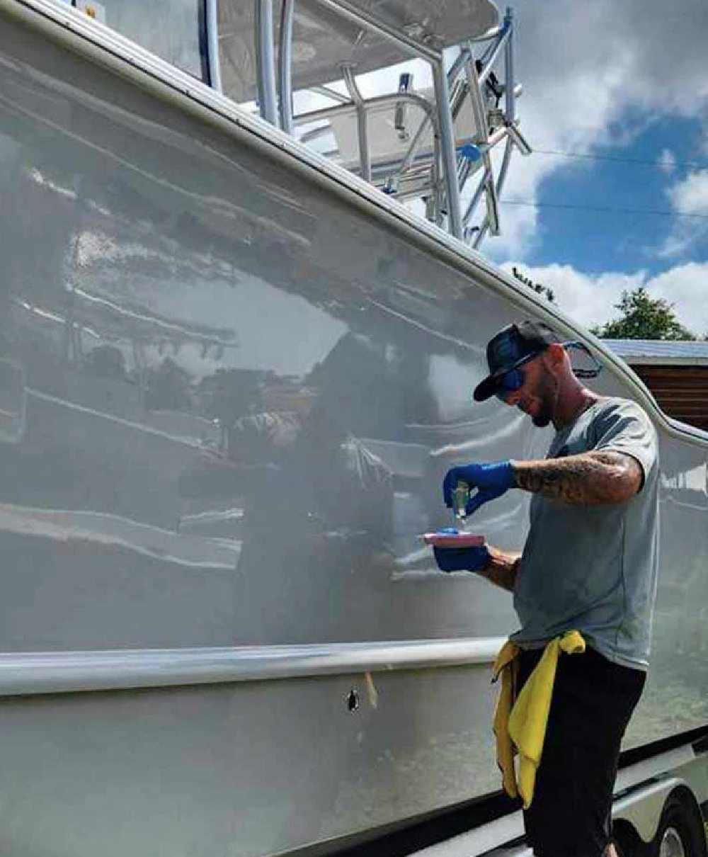 Freshly restored gelcoat surface on a boat hull