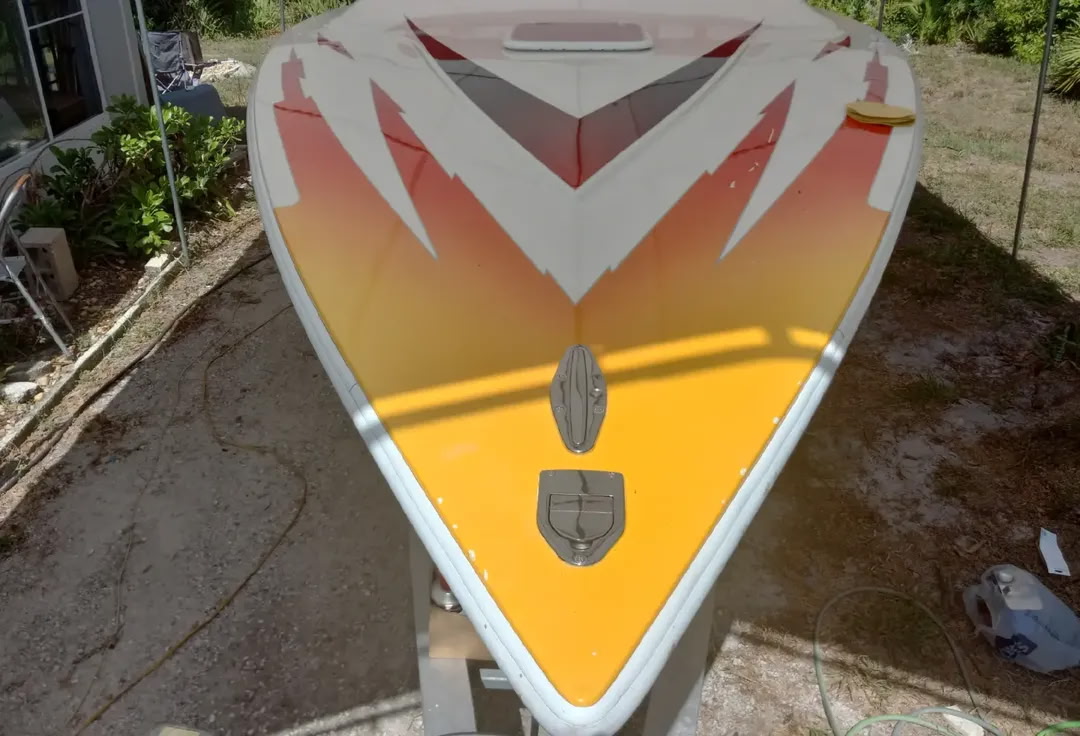 Before: Velocity 29 hull with worn original paint